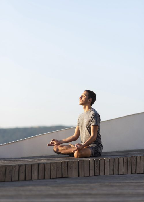 full-shot-man-doing-sukhasana-pose-outdoor full-shot-man-doing-sukhasana-pose-outdoor